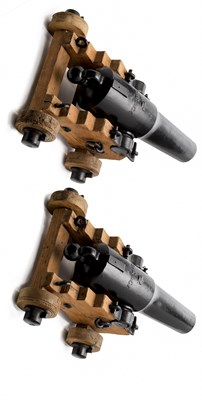 Lot 409 - TWO SIX POUNDER IRON CANNON