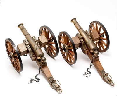 Lot 419 - A PAIR OF MINIATURE ROYAL ARTILLERY FIELD GUNS IN 19TH CENTURY STYLE
