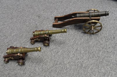 Lot 433 - A PAIR OF BRONZE MINIATURE NAVAL CANNON AND ANOTHER MINIATURE CANNON
