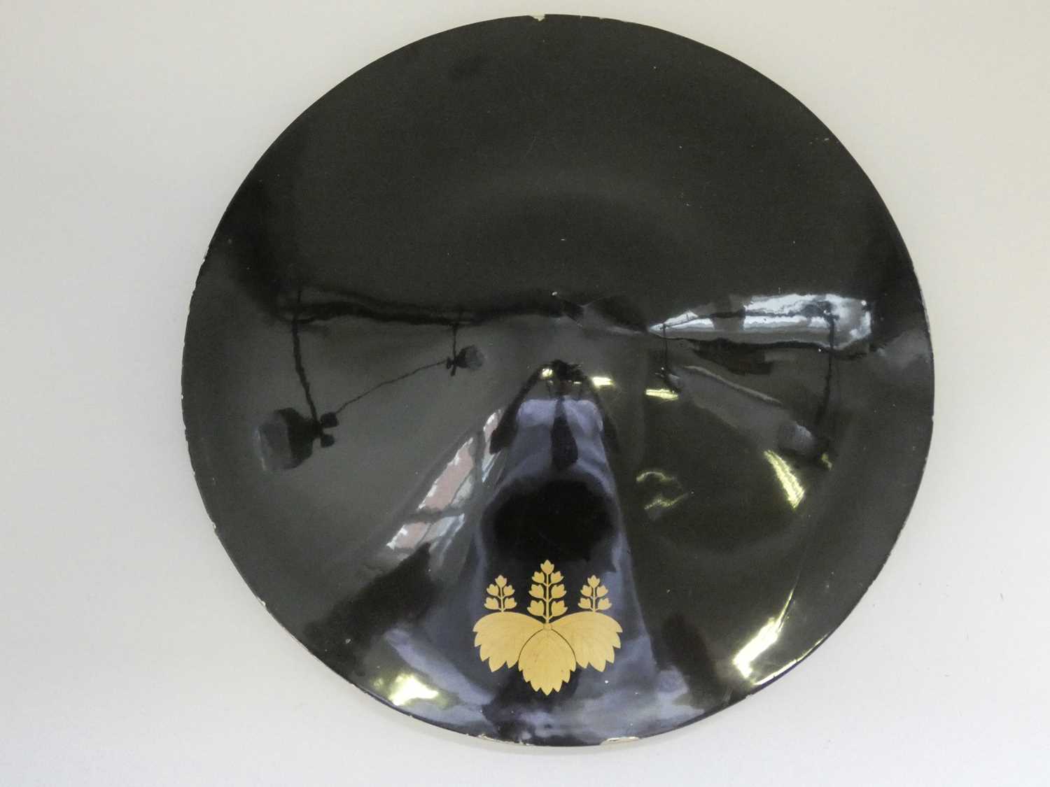 Lot 98 - A JINGASA (WAR HAT) OF LIGHT WOOD COVERED WITH BLACK LACQUER