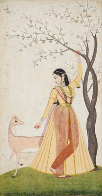 Lot 678 - A LADY WITH A DEER UNDER A BLOSSOMING TREE, PAHARI, NORTH-WESTERN INDIA, EARLY 19TH CENTURY