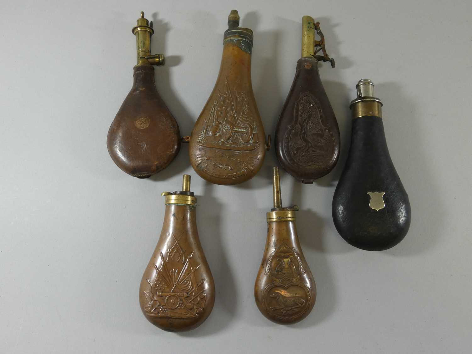Lot 417 - A LEATHER POWDER FLASK BY G & J. W. HAWKSLEY, AND OTHER FLASKS
