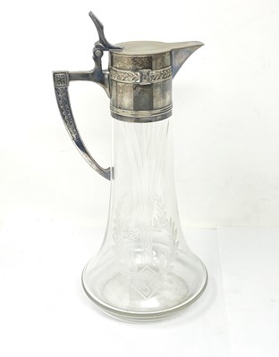 Lot 137 - AN ELECTROPLATE-MOUNTED GLASS CLARET JUG