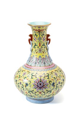 Lot 16 - A CHINESE FINELY ENAMELLED FAMILLE-ROSE YELLOW-GROUND 'LOTUS' BOTTLE VASE, 20TH CENTURY