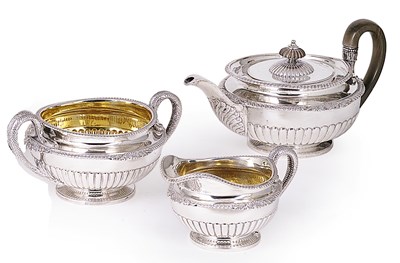 Lot 209 - A GEORGE III SILVER THREE-PIECE TEA SET