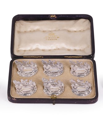 Lot 256 - A SET OF SIX EDWARDIAN SILVER 'MOTOR CAR' CARD HOLDERS