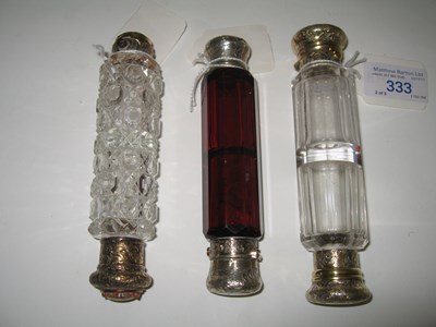 Lot 333 - THREE VICTORIAN SILVER-MOUNTED DOUBLE-ENDED SCENT FLASKS