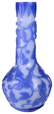 Lot 20 - â€¡ A CHINESE BLUE OVERLAID WHITE GLASS BOTTLE VASE