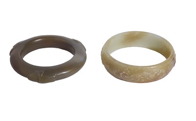 Lot 51 - TWO CHINESE ARCHAISTIC JADE BI RINGS