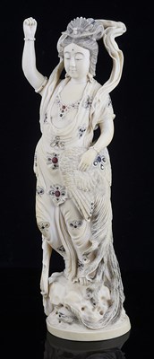 Lot 74 - ËœA JAPANESE IVORY OKIMONO OF A TENNIN