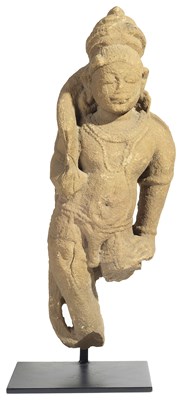 Lot 121 - A BUFF SANDSTONE FIGURE OF AN ATTENDANT