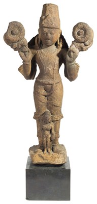 Lot 122 - A PINKISH BUFF SANDSTONE FIGURE OF SURYA