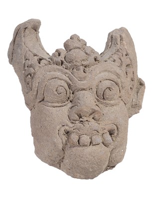 Lot 129 - A MAJAPAHIT TERRACOTTA FRAGMENTARY HEAD OF KIRTIMUKHA