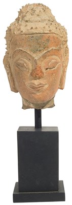 Lot 131 - A TERRACOTTA HEAD OF BUDDHA