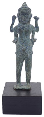 Lot 145 - A SMALL KHMER BRONZE FIGURE OF A FOUR-ARMED DEITY