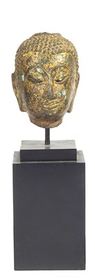 Lot 147 - A SMALL AYUTHIA FRAGMENTARY GILT-BRONZE HEAD OF BUDDHA