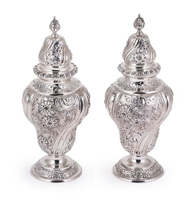 Lot 208 - A PAIR OF VICTORIAN SILVER CASTERS