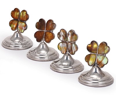 Lot 355 - A SET OF FOUR GEORGE V SILVER 'FOUR-LEAF CLOVER' CARD HOLDERS