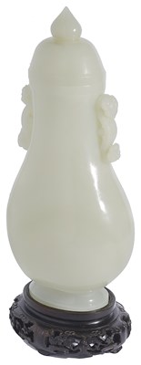 Lot 35 - A CHINESE CELADON JADE PEAR-SHAPED VASE AND COVER