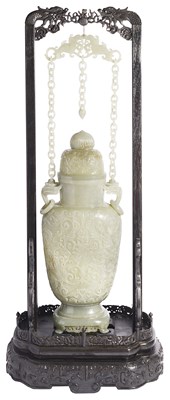 Lot 48 - A CHINESE MUGHAL-STYLE JADE BALUSTER VASE AND COVER WITH CHAIN HANDLE