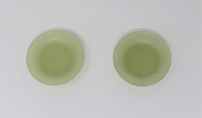 Lot 82 - A PAIR OF CHINESE CELADON JADE MINIATURE SAUCERS