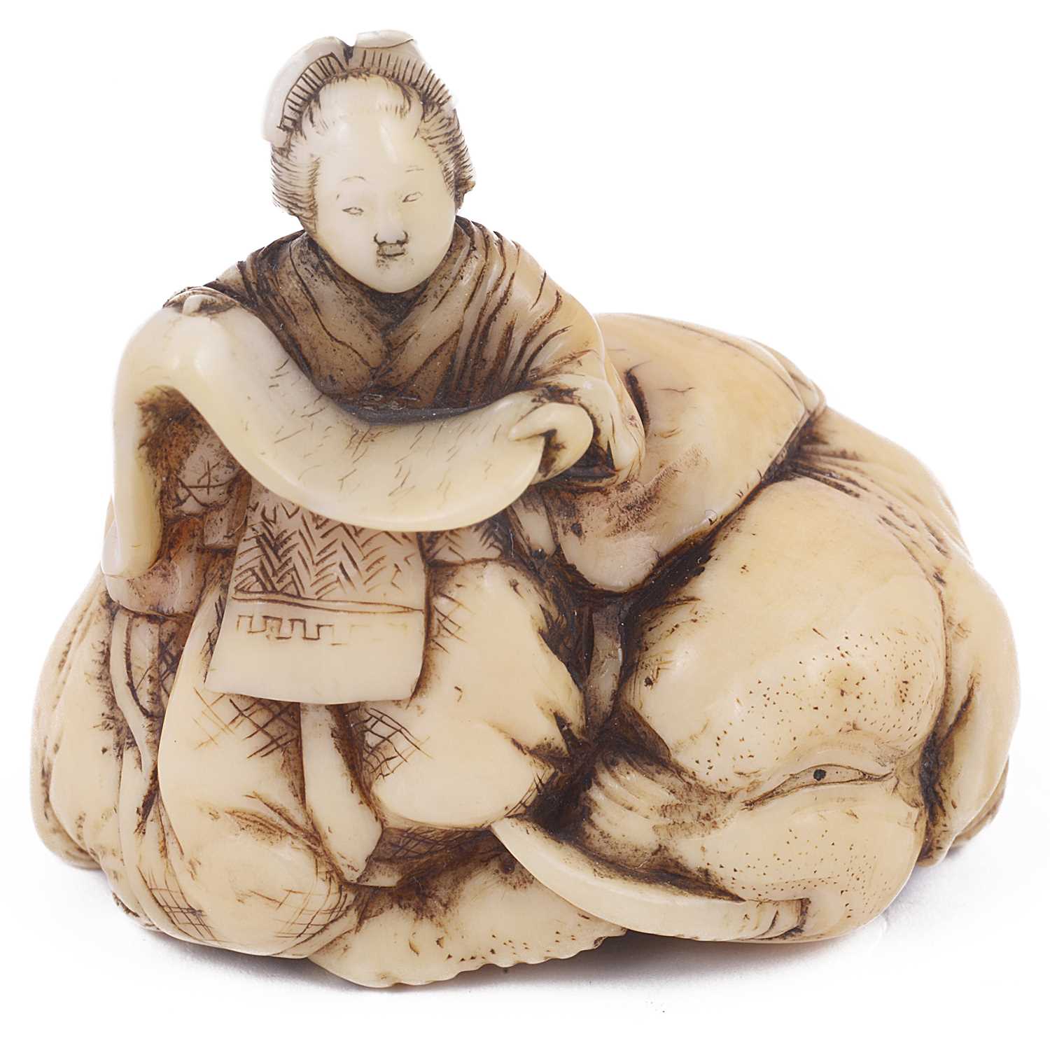 Lot 113 - ~IVORY NETSUKE OF KIMI NO EGUCHI ON A RECUMBENT ELEPHANT