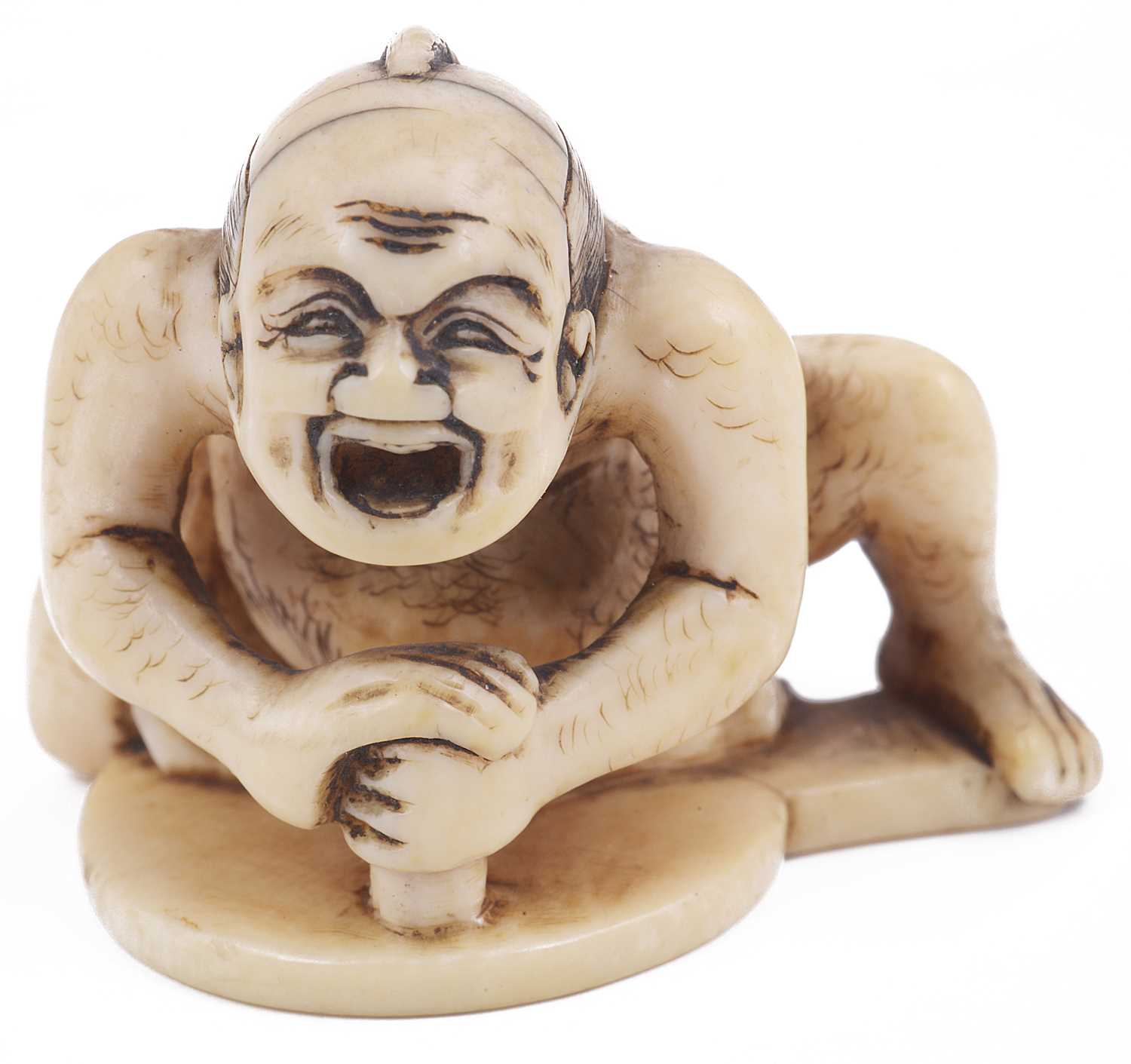 Lot 122 - ~IVORY NETSUKE OF A MIRROR POLISHER