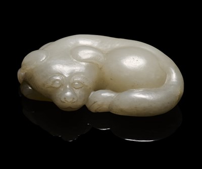 Lot 89 - A CHINESE CELADON-WHITE JADE DOG, QING DYNASTY (1644-1911)