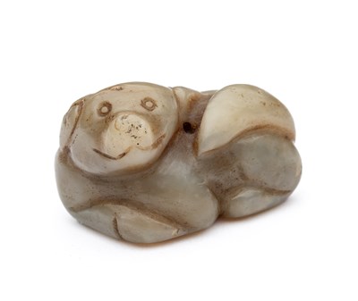 Lot 58 - A CHINESE CELADON JADE DOG, QING DYNASTY (1644-1911)