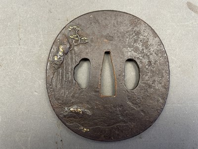 Lot 10 - A JAPANESE IRON TSUBA (HAND GUARD) OF MARU GATA (ROUND FORM), CIRCA 1700-1800