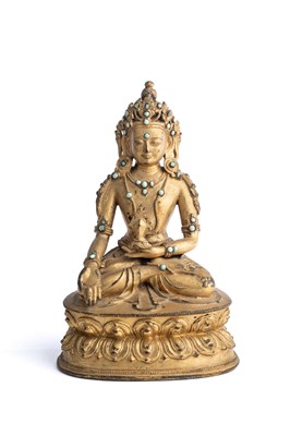 Lot 532 - A SINO-TIBETAN GILT BRONZE FIGURE OF RATNASAMBHAVA, 18TH CENTURY