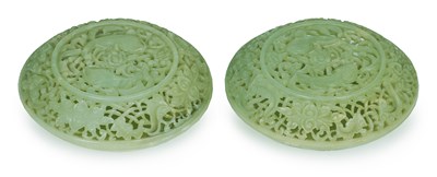 Lot 58 - â€¡A PAIR OF CHINESE PIERCED CIRCULAR JADE BOXES AND COVERS