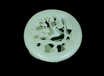 Lot 70 - A CHINESE JADE DISC