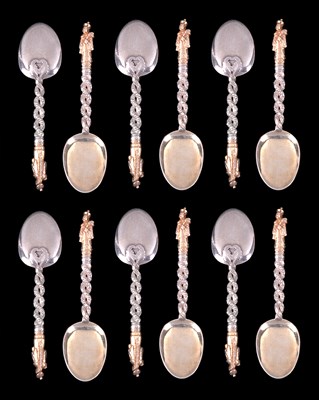 Lot 83 - A SET OF TWELVE CHINESE PARCEL-GILT-SILVER DECORATIVE TEASPOONS