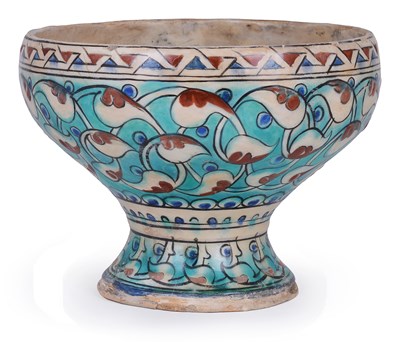 Lot 92 - AN IZNIK POTTERY FOOTED BOWL