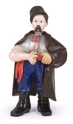Lot 103 - A RUSSIAN STYLE CARVED HARDSTONE FIGURE OF A UKRANIAN PEASANT