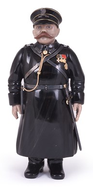 Lot 104 - A RUSSIAN STYLE CARVED HARDSTONE FIGURE OF A POLICEMAN