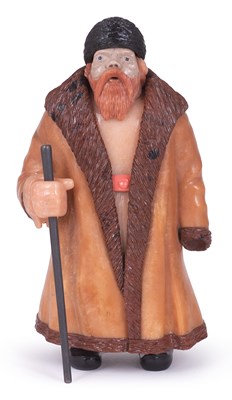 Lot 106 - A RUSSIAN STYLE CARVED HARDSTONE FIGURE OF A MUJIK WITH STICK