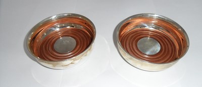 Lot 168 - A PAIR OF AMERICAN SILVER WINE COASTERS