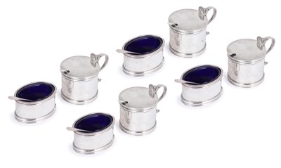 Lot 192 - A SET OF FOUR SILVER MUSTARD POTS AND FOUR SALT CELLARS