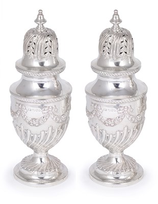 Lot 205 - A PAIR OF VICTORIAN SILVER CASTERS