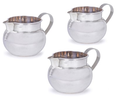 Lot 207 - A SET OF THREE GEORGE V SILVER MILK JUGS