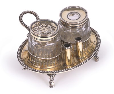 Lot 269 - A GEORGE III SILVER-GILT TWO-BOTTLE INSTAND