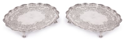 Lot 276 - A PAIR OF GEORGE III AND LATER FLAT-CHASED SILVER SALVERS