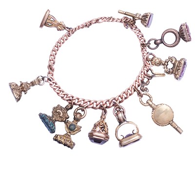 Lot 368 - 9CT CHARM BRACELET WITH ELEVEN SEALS