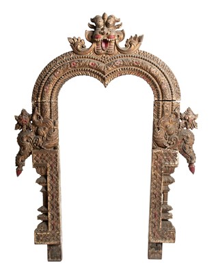 Lot 650 - A CARVED AND PAINTED WOOD ARCH FROM A SHRINE, TAMIL NADU, SOUTH INDIA, 19TH CENTURY