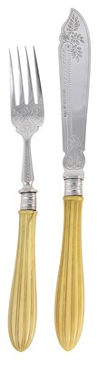 Lot 393 - ËœA SET OF TWELVE VICTORIAN SILVER AND IVORY FISH KNIVES AND ELEVEN FORKS