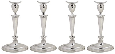 Lot 425 - A SET OF FOUR GEORGE V SILVER CANDLESTICKS