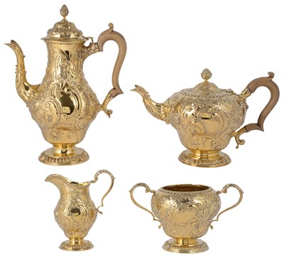 Lot 434 - AN EDWARDIAN SILVER-GILT FOUR-PIECE TEA AND COFFEE SET