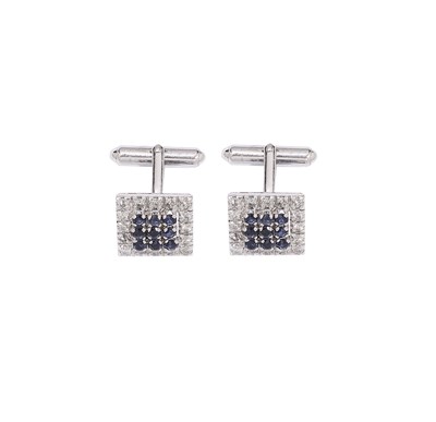 Lot 576 - A PAIR OF DIAMOND AND SAPPHIRE CUFFLINKS